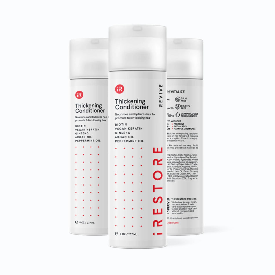 Image showing three bottles of the REVIVE Thickening Conditioner.