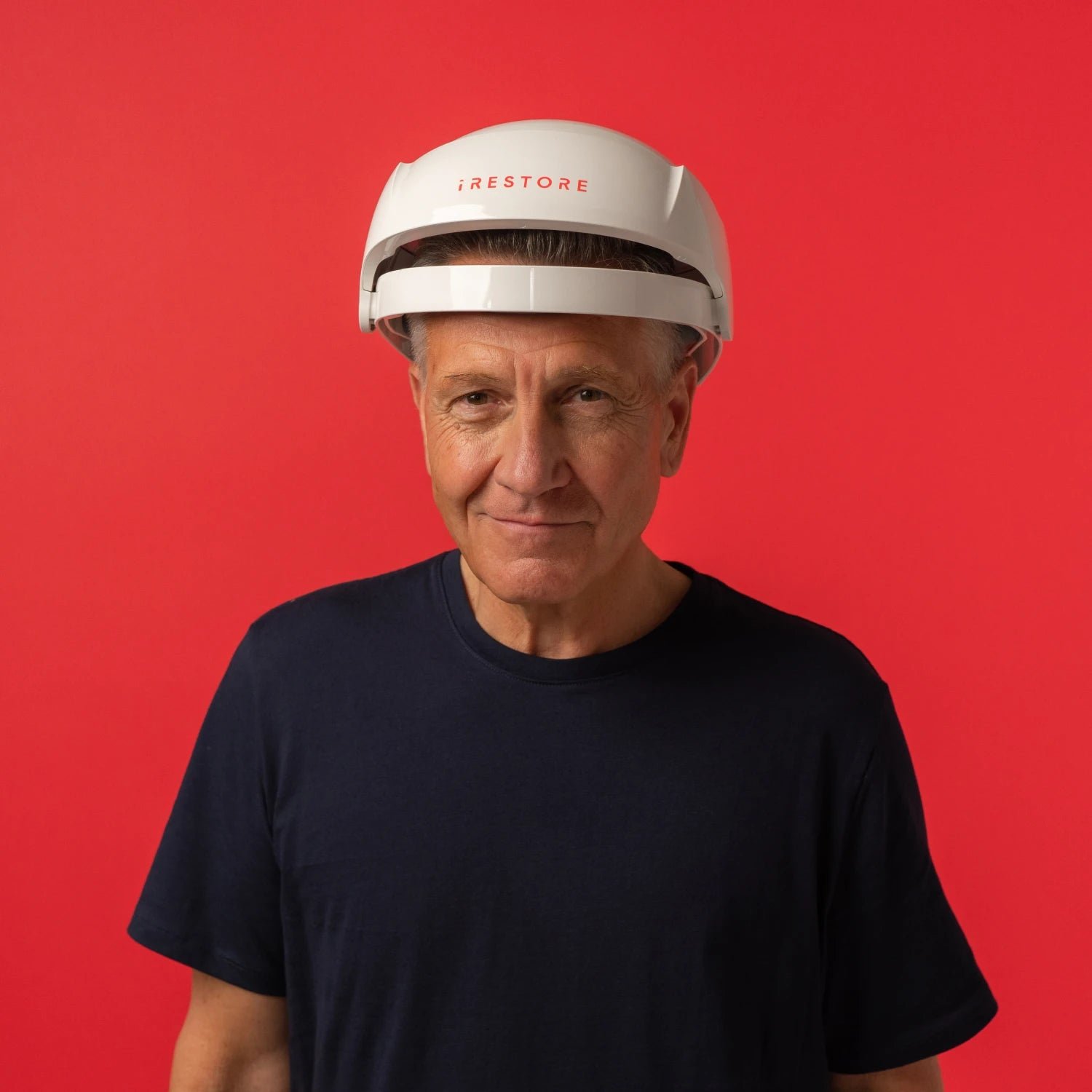 Image of a mature man wearing the Essential hair device.