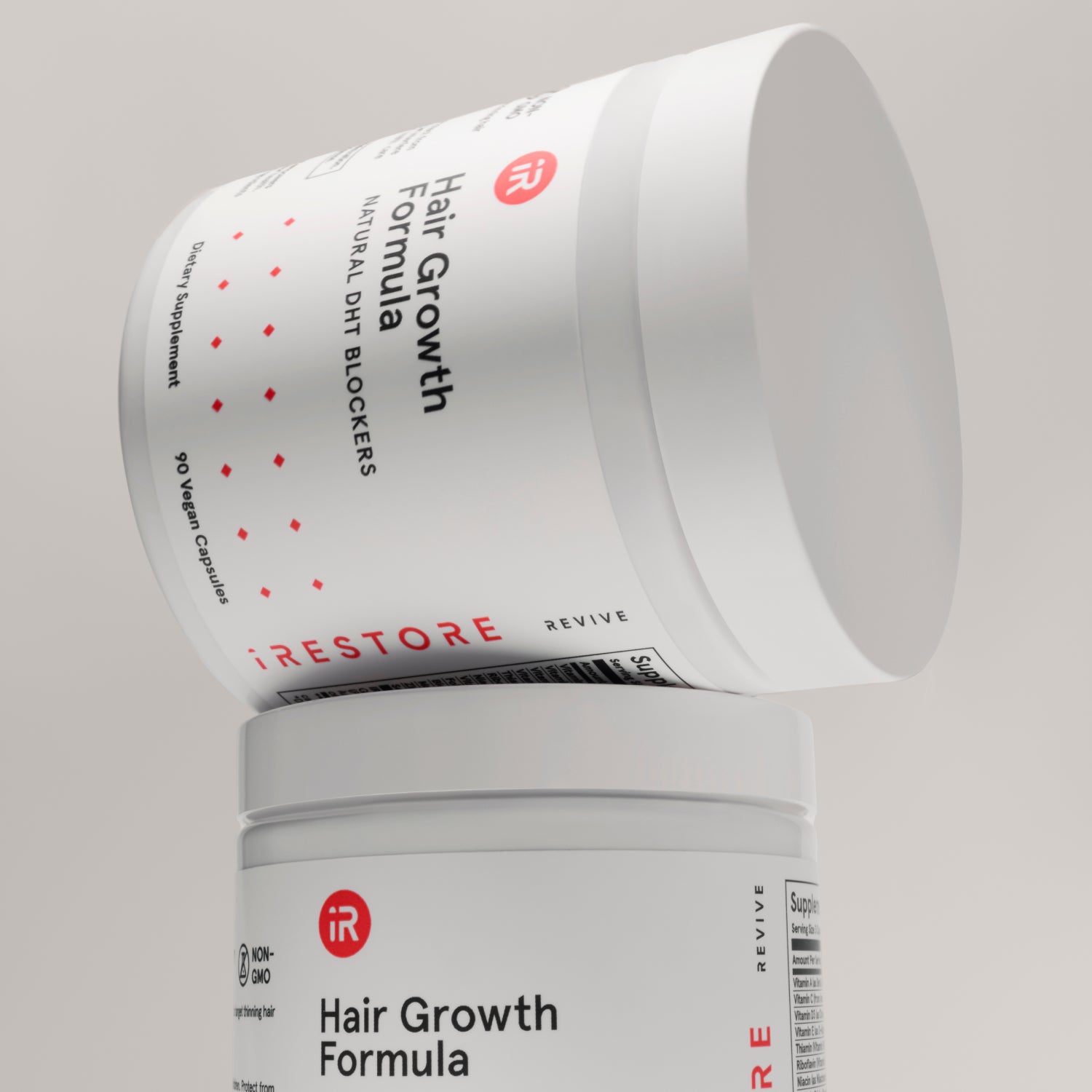 hair growth formula bottle on top of hair growth formula bottle