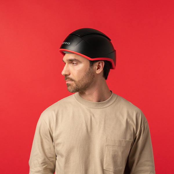 Image of a middle aged man wearing the Elite hair device.