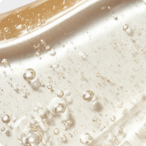 close up of clear serum with bubbles
