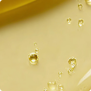 close up of yellow serum with bubbles
