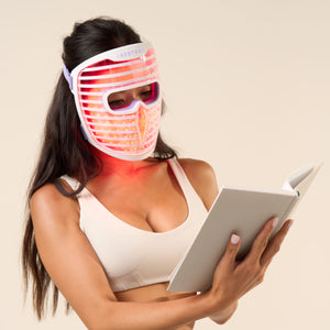 woman wearing LED face mask