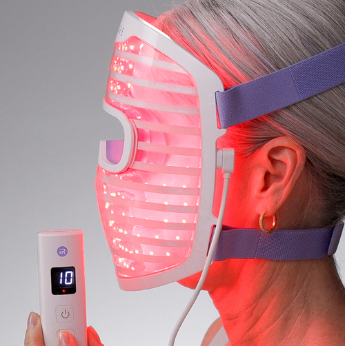 side view of woman wearing LED face mask