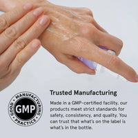 Hand applying Vitamin C Serum with a GMP certification logo and text on a white background