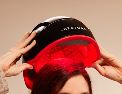 Close up shot of elite device on top of woman's head