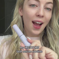Woman showcasing her eyelash enhancing serum  routine