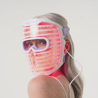 Woman wearing the LED facemask showcasing the different light modes