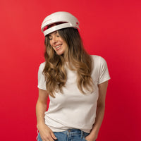 Image of a middle aged woman wearing the Essential hair device.