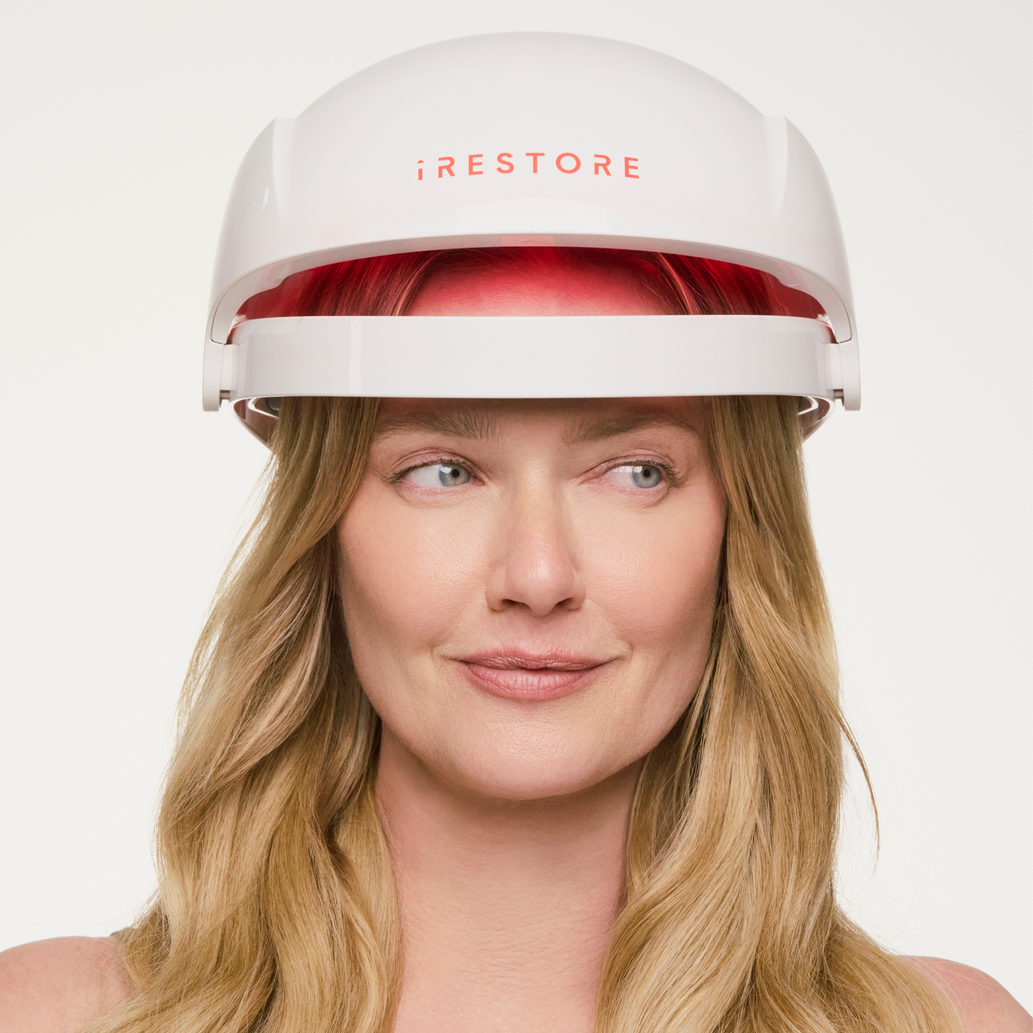 woman wearing the Essential hair device.