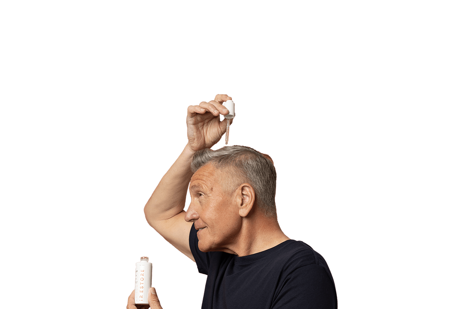 Mature man putting droplets of growth activator serum on his hair