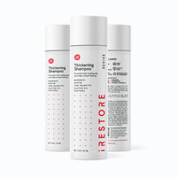 Image showing three bottles of the REVIVE Thickening Shampoo.