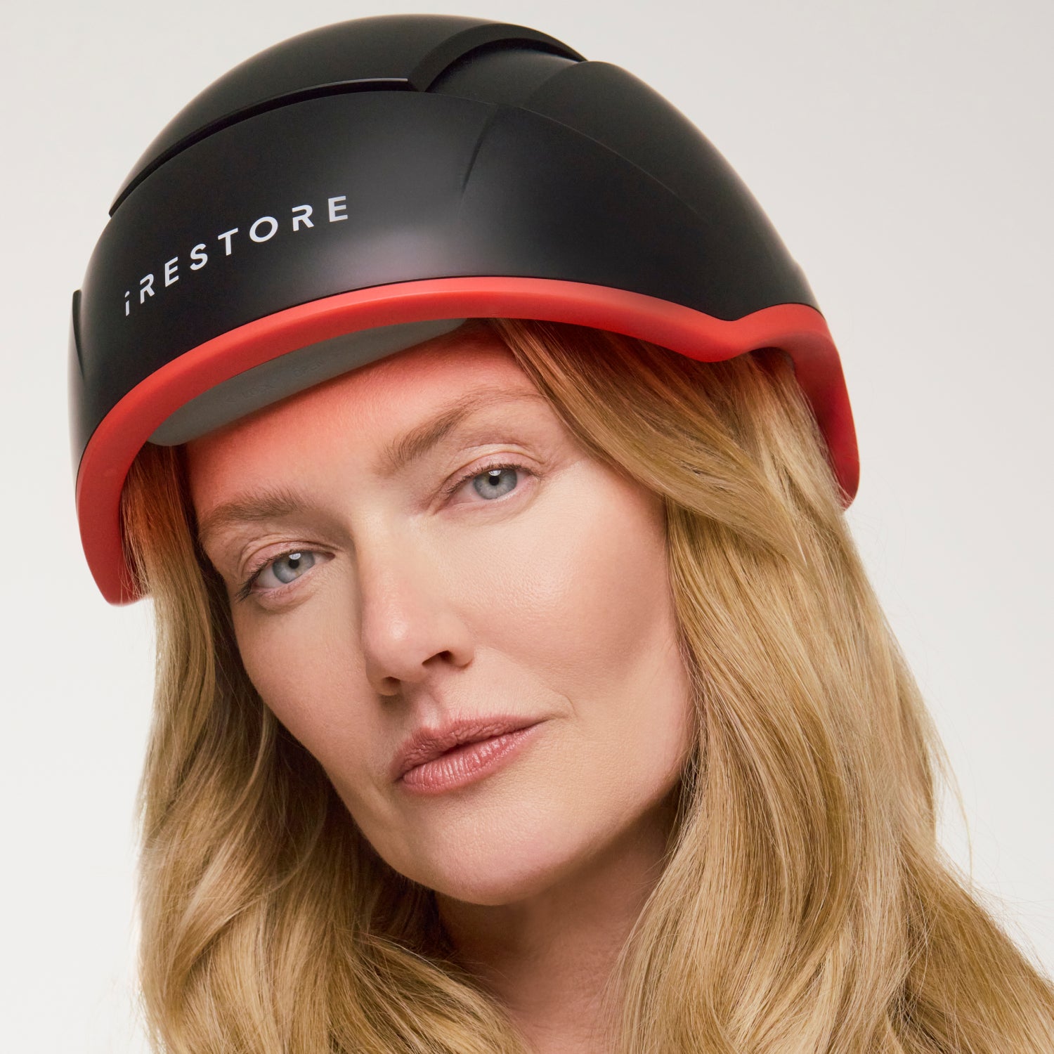 woman wearing the elite hair device.