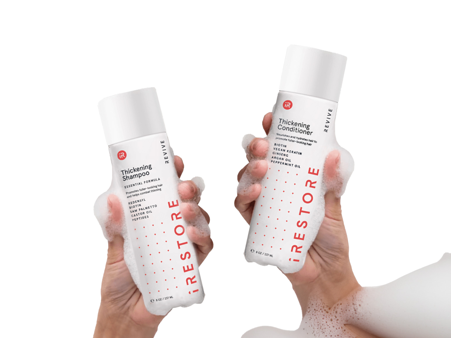 Left and holding thickening shampoo and right hand holding thickening conditioner.
