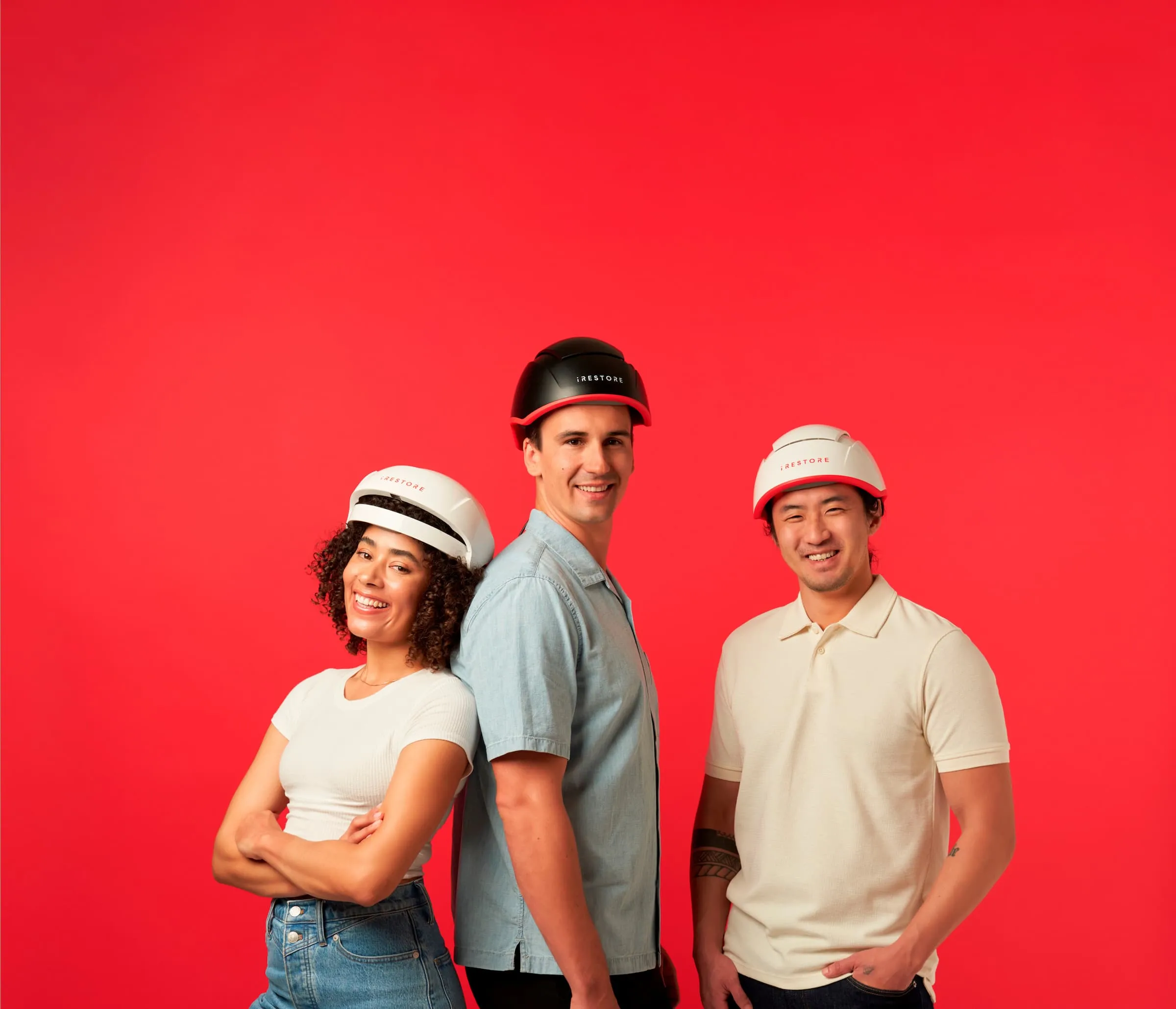 woman wearing essential hair device, man wearing elite hair device, man wearing professional hair device.