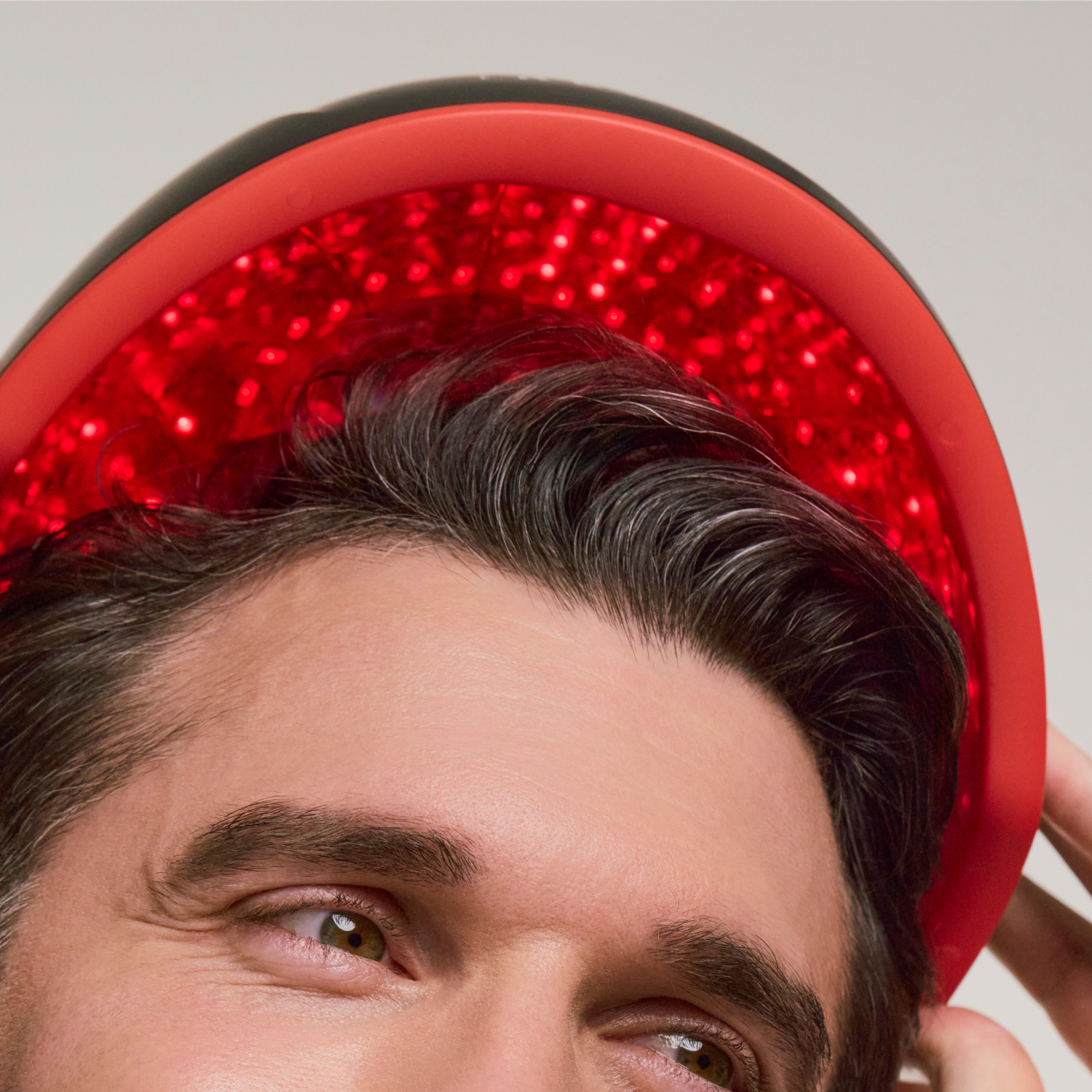 man wearing the Elite hair device. 
