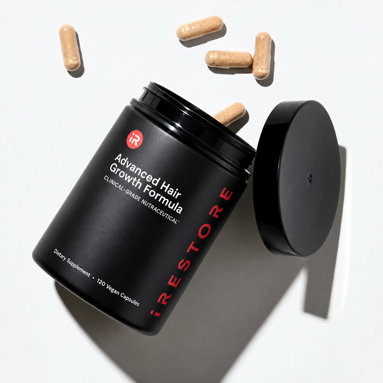 Advanced Hair Growth Formula opened against table