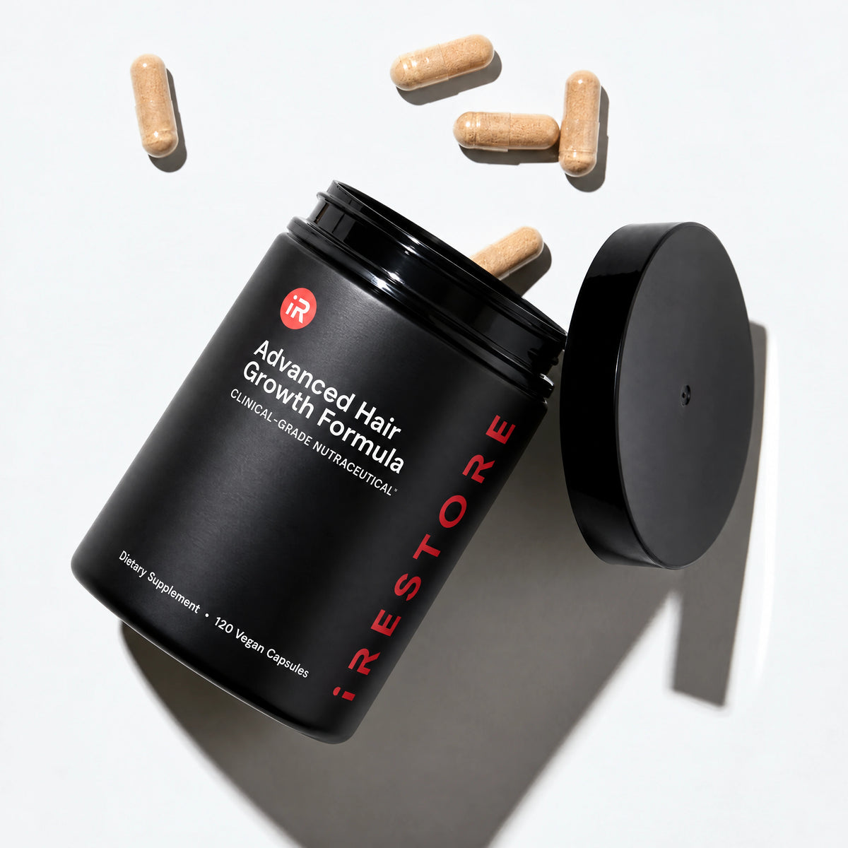Advanced Hair Growth Formula opened against table