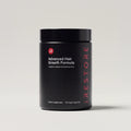Advanced Hair Growth Formula against a clean grey background.