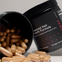advanced hair growth formula bottle beside and open advanced hair growth formula bottle with tablets falling out