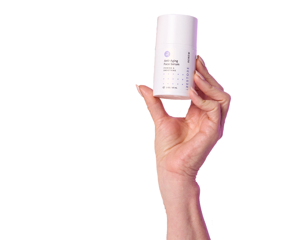 Hand holding the anti-aging face serum