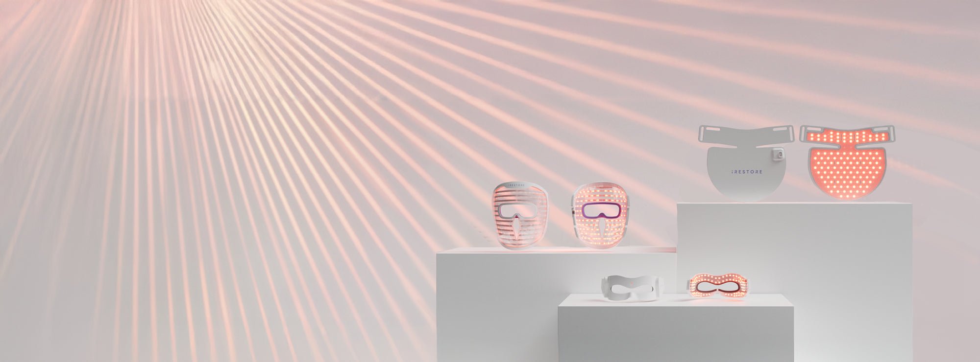 Image banner of the Illumina Face Mask, Illumina Neck and Chest Mask and Illumina Eye Mask with laser beams in the background.