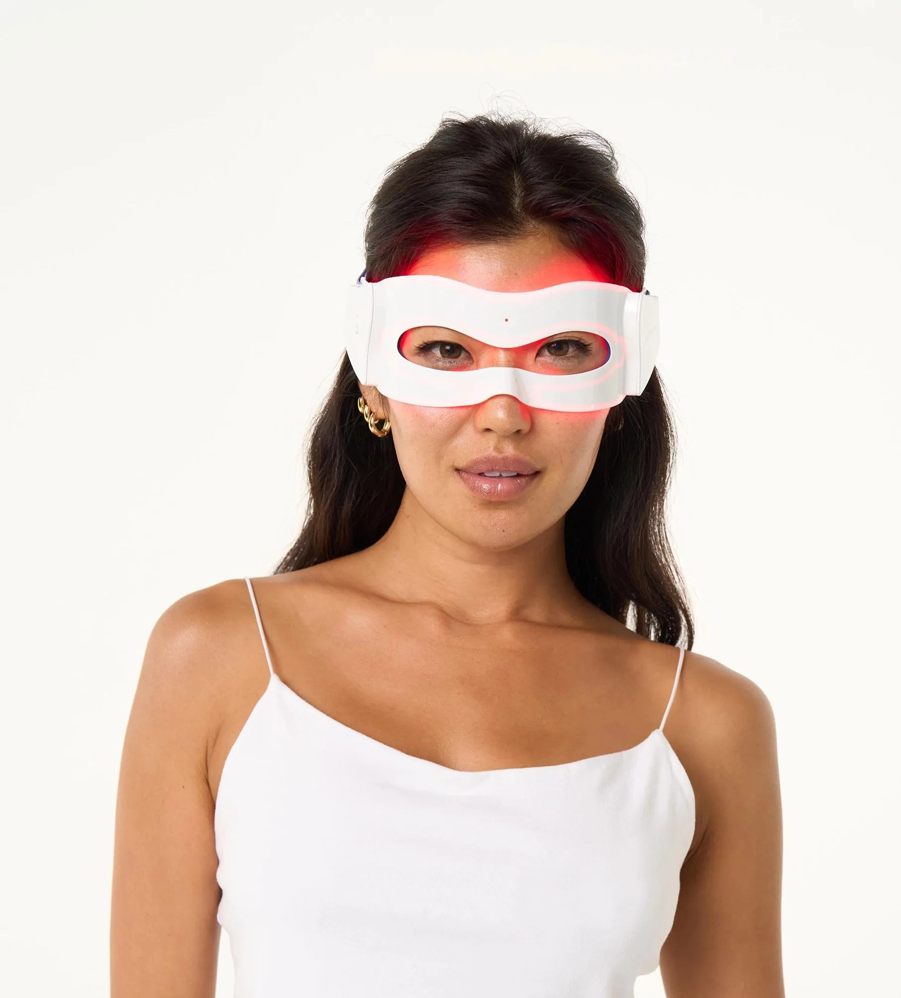 Woman wearing the LED eye mask with red lights turned on