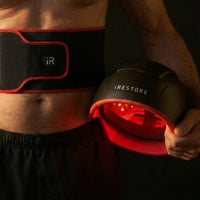 Man holding irestore elite and wearing sculpt belt