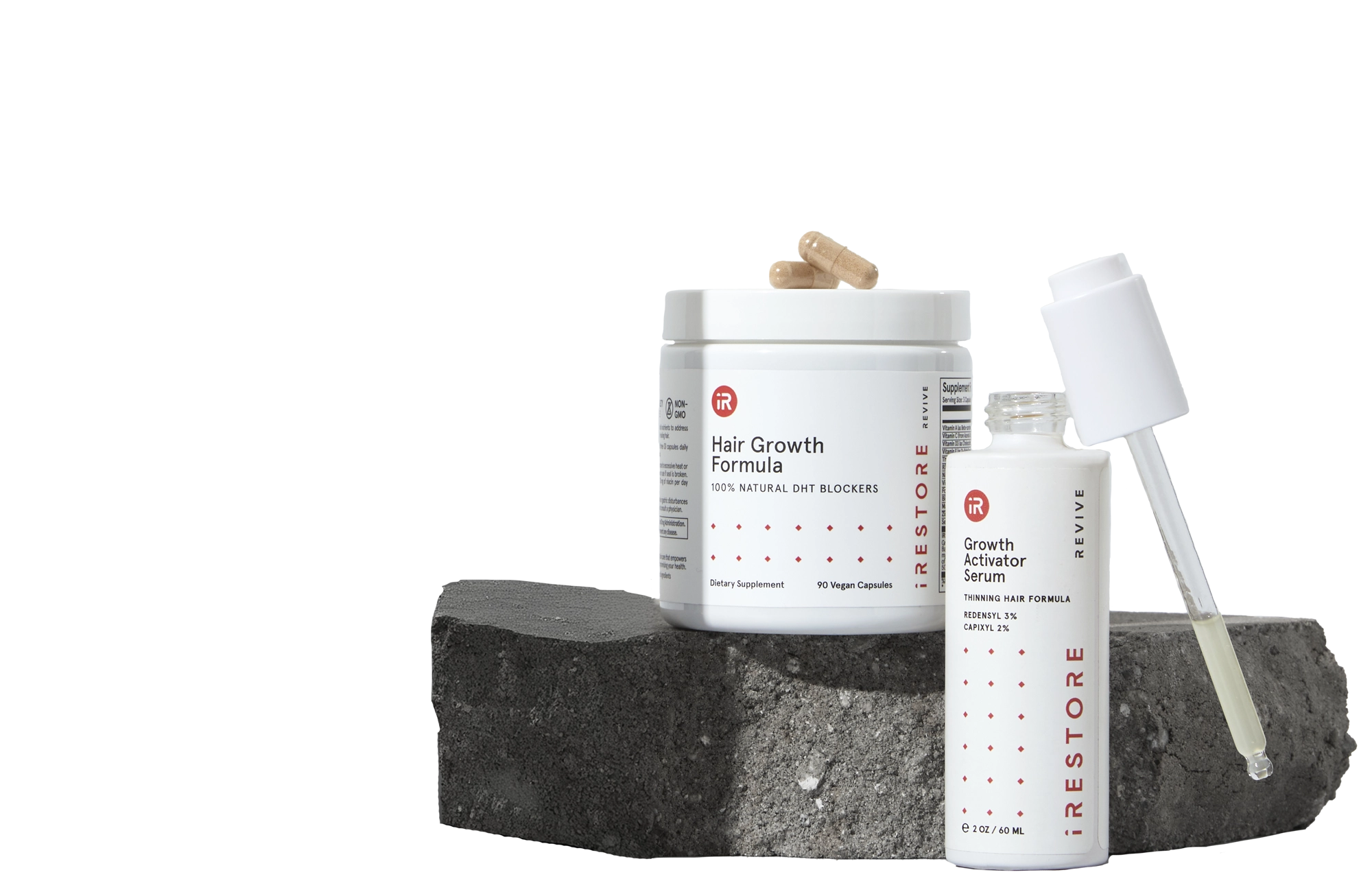 Image showing the REVIVE Growth Accelerator Kit place on top of a rock.