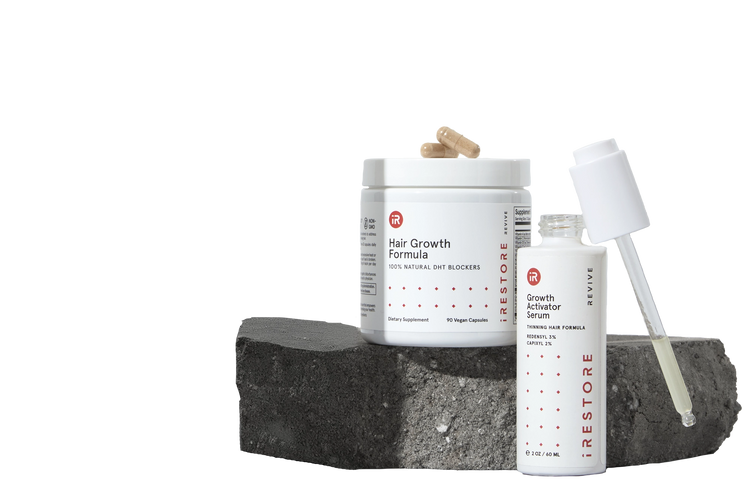 Image showing the REVIVE Growth Accelerator Kit place on top of a rock.