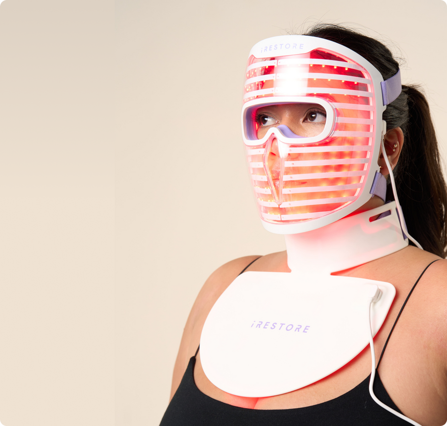 Woman wearing both the irestore Illumina LED face mask and neck and chest mask