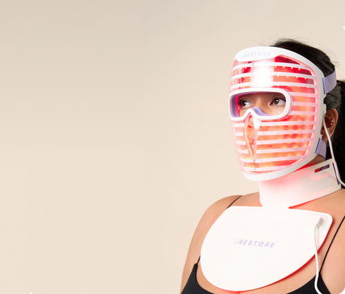 Woman wearing both the irestore Illumina LED face mask and neck and chest mask