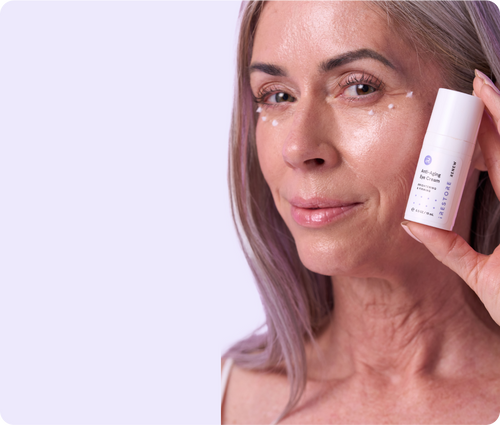 Woman holding the Anti Aging Eye Cream Bottle