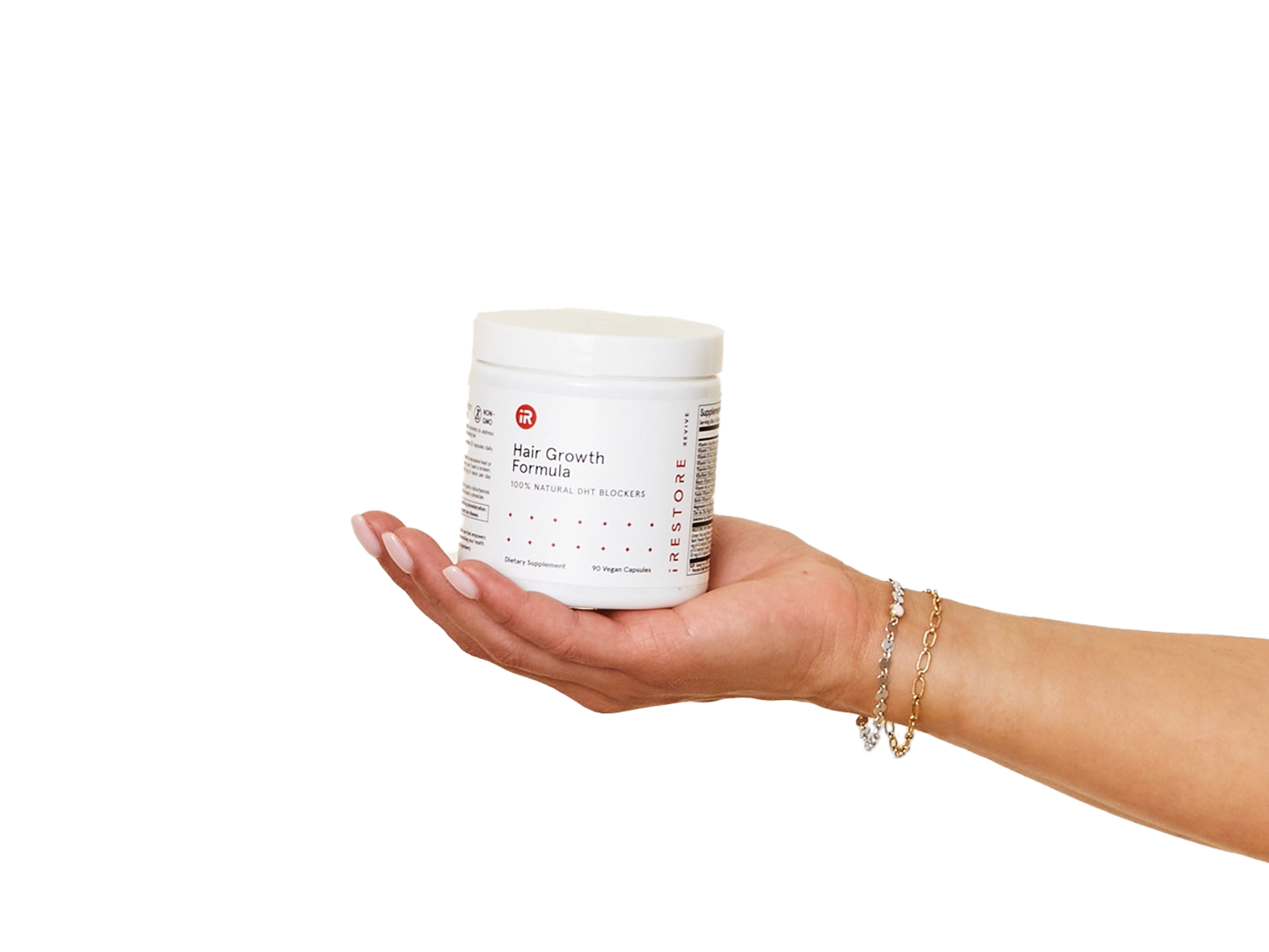 Close up shot of hand holding holding the Hair Growth Formula container