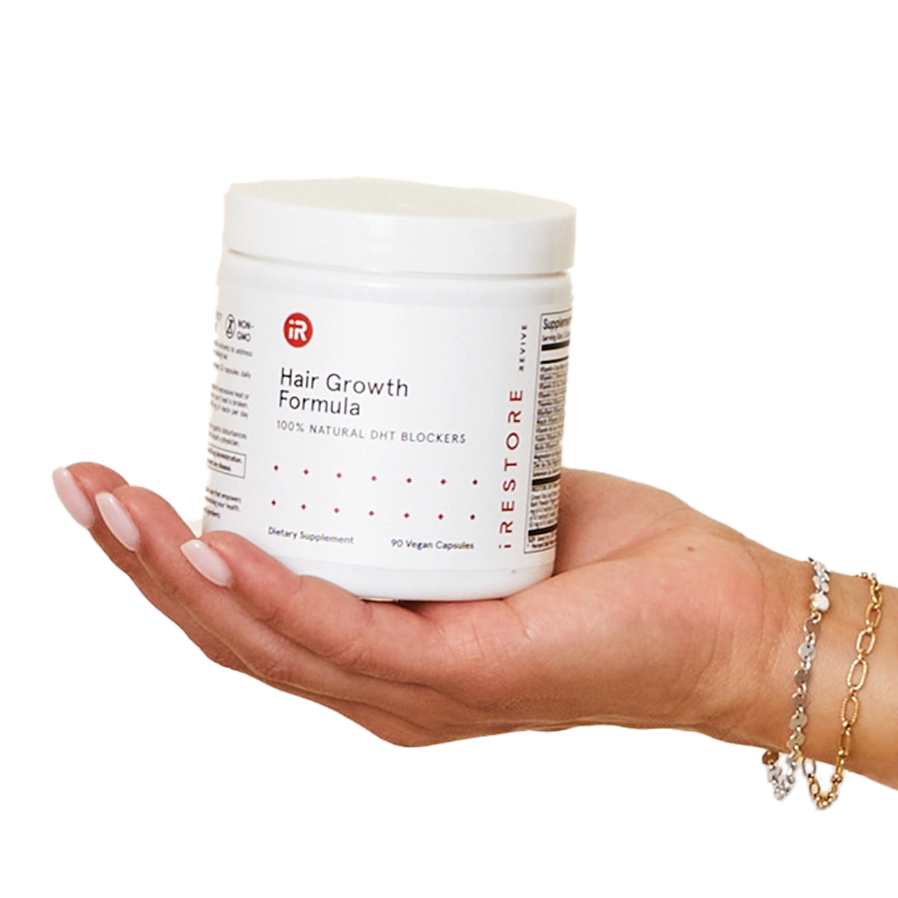 Image of a hand holding the jar of Hair Growth Formula.