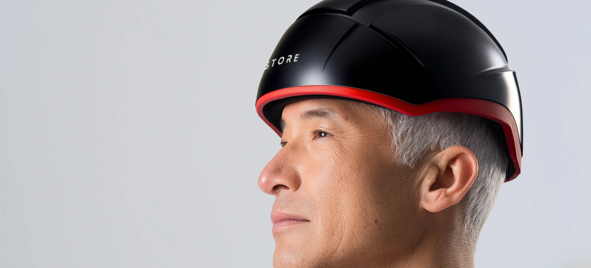 Person wearing an iRESTORE Elite on a light gray background
