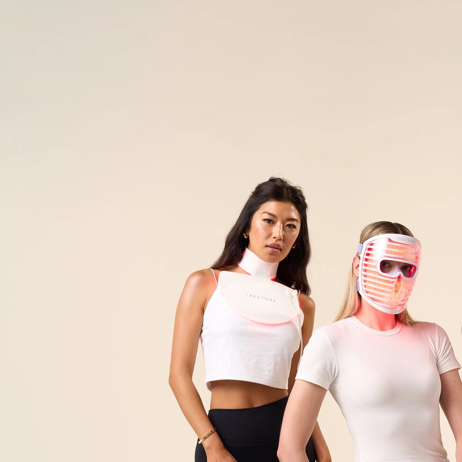 Image of two women, one wearing the Neck and Chest Mask while the other one is wearing the Illumina Face Mask.