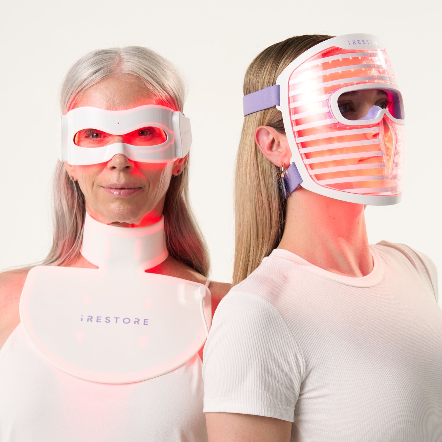 Woman wearing illumina eye mask and neck & chest mask next to woman wearing illumina face mask.