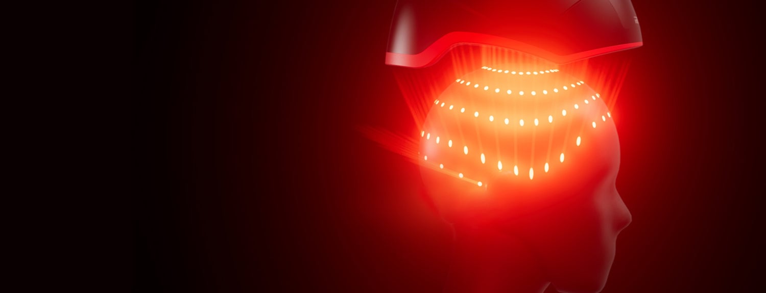 3D Image of the Elite helmet device placed on top of a 3D model head showing the lasers beams.