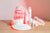 LED face mask, LED neck and chest mask, LED eye mask, Calming facial spray, Hydrating foam cleanser, Anti-aging face serum, and Anti-aging eye cream on top of a wooden table