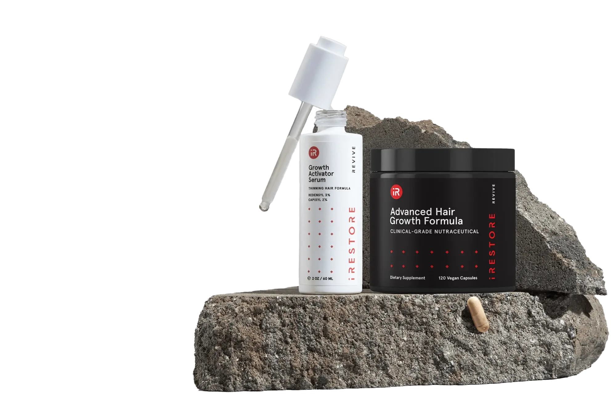Image showing the REVIVE+ Growth Accelerator Kit place on top of a rock.