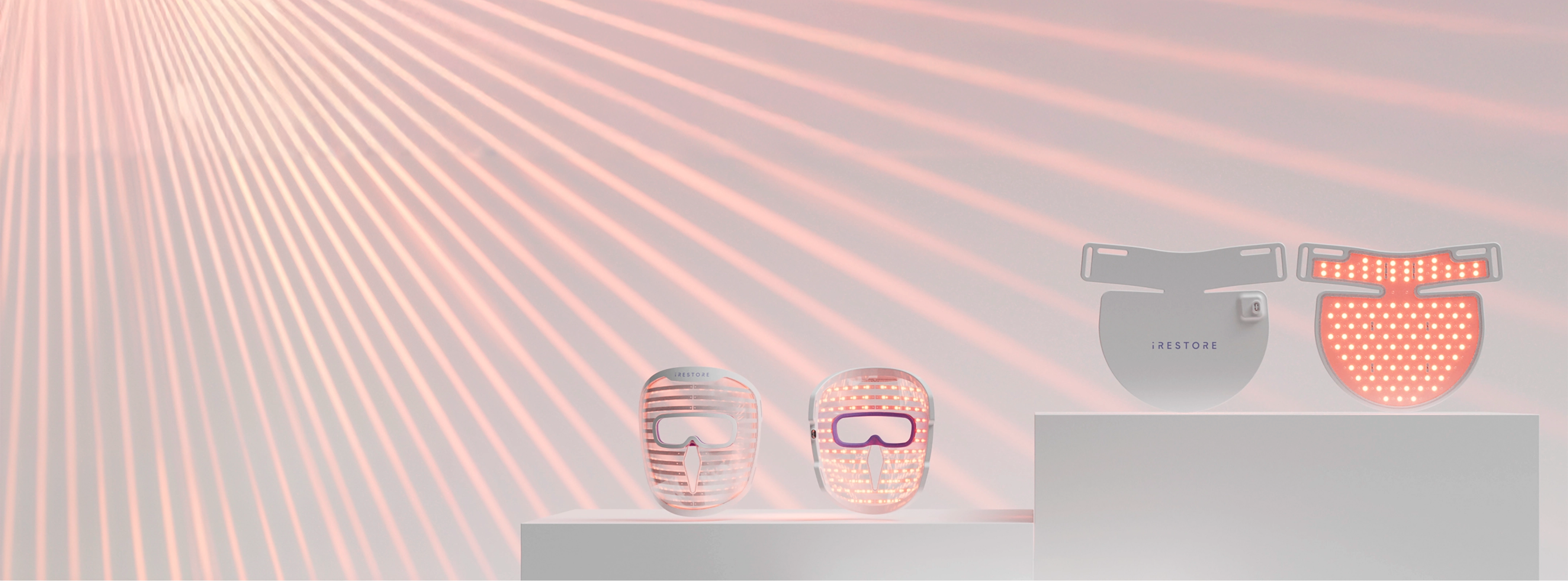 Image banner of the Illumina Face Mask and Illumina Neck and Chest Mask with laser beams in the background.
