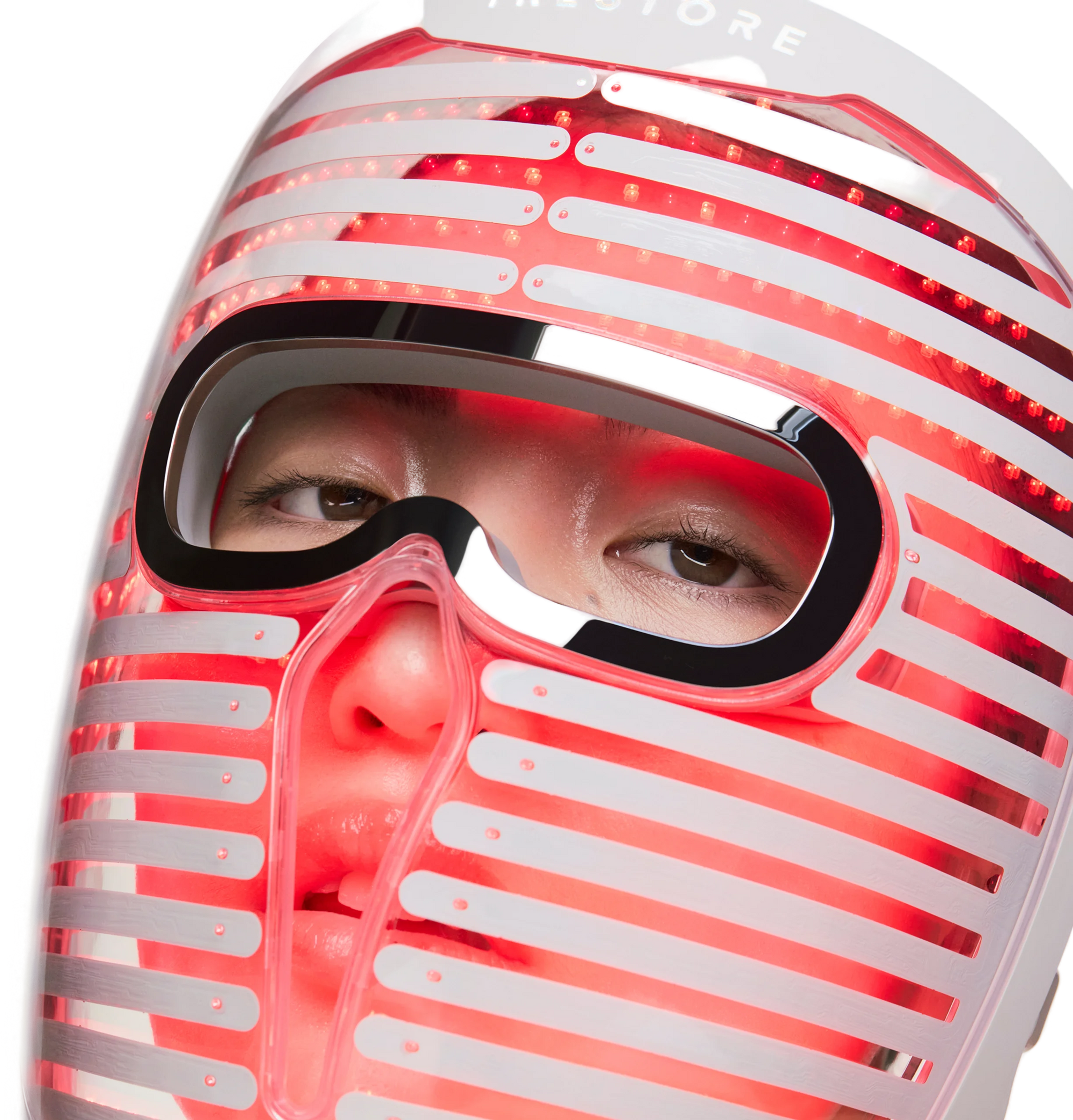 woman wearing a glowing face mask pro