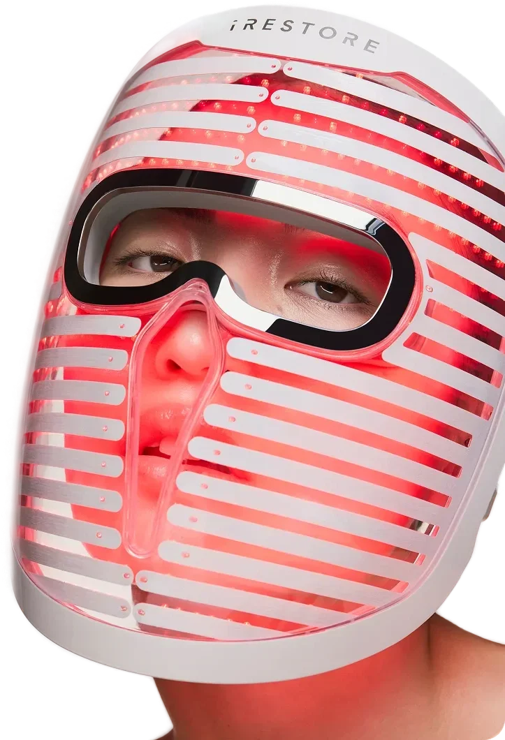 woman wearing a glowing face mask pro