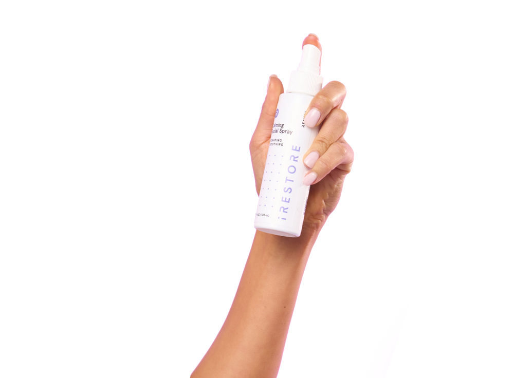 Hand holding the Calming facial spray