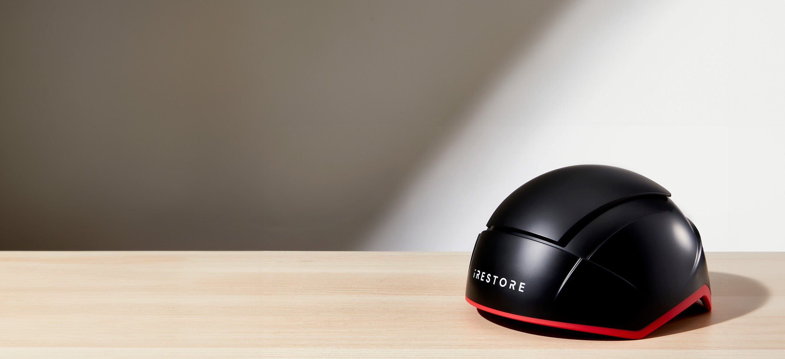 Elite hair device placed on top of a table.