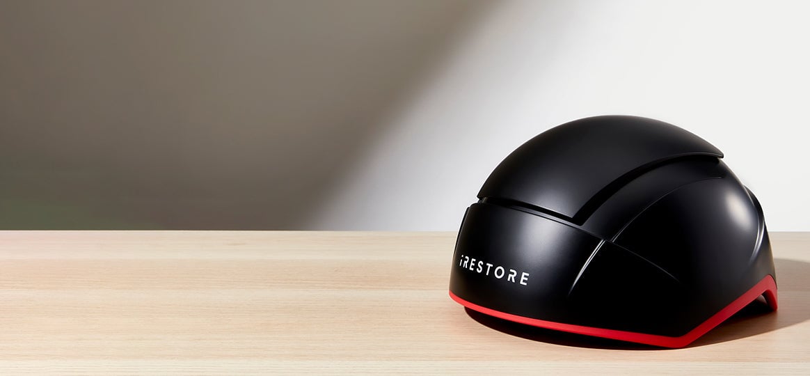 Elite hair device placed on top of a table.