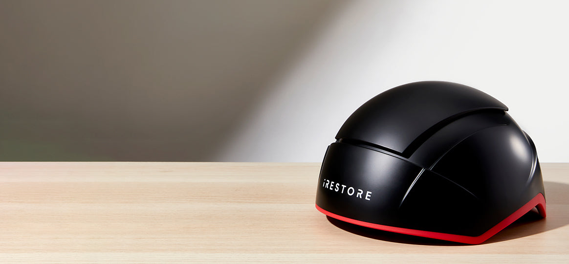 Elite hair device placed on top of a table.