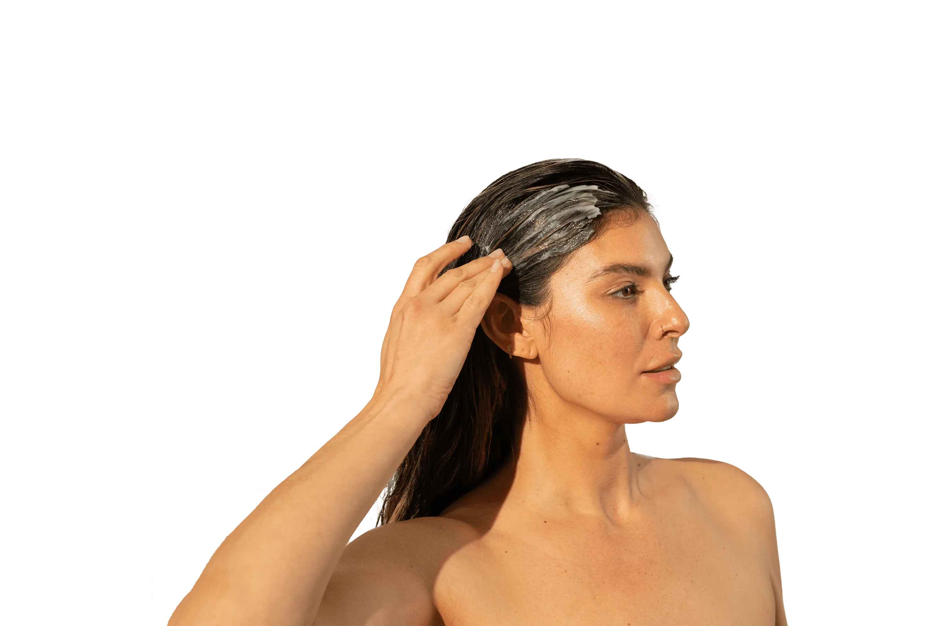 Image of a woman applying a Thickening Conditioner on her long hair.
