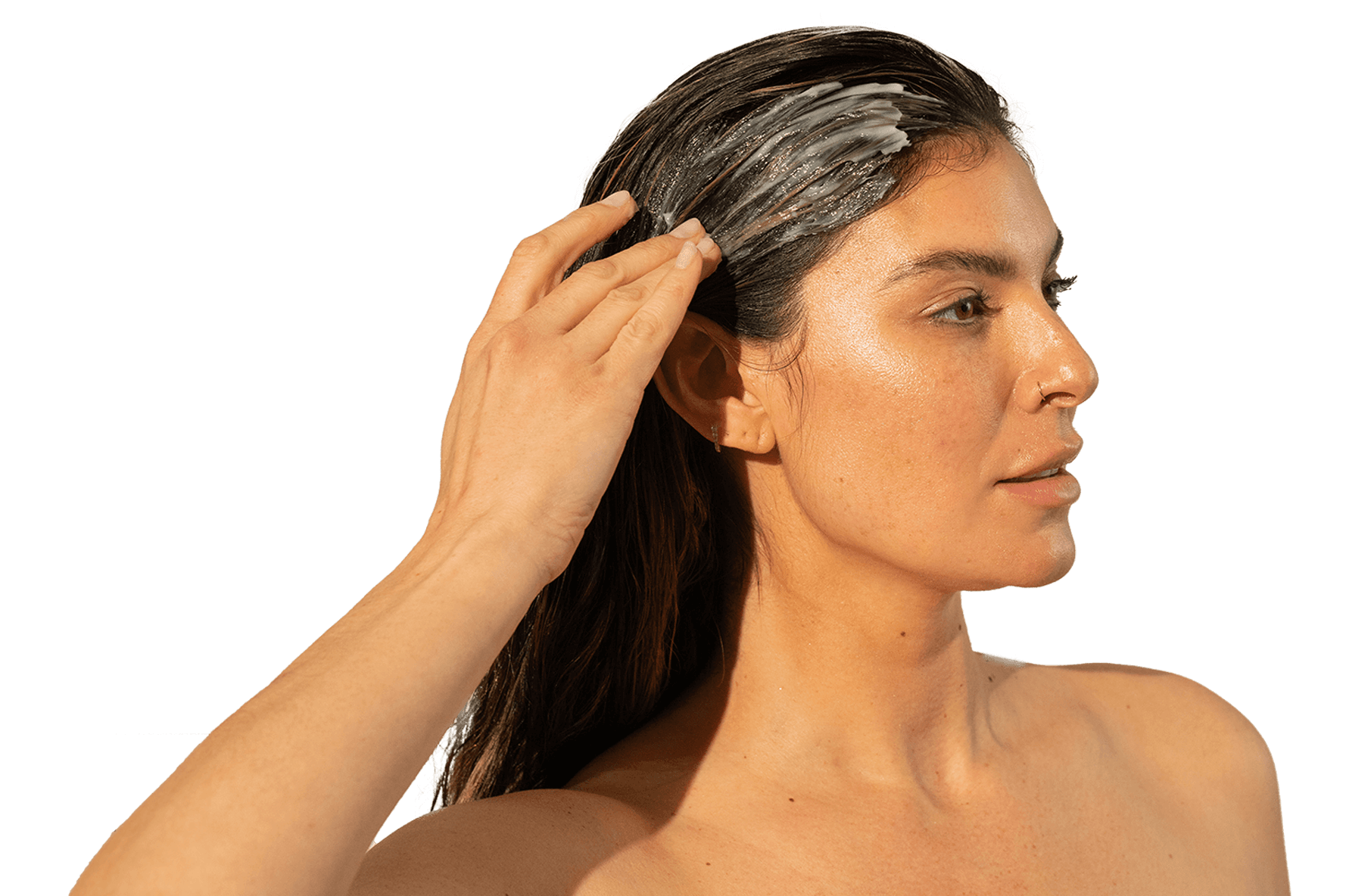 Image of a woman applying a Thickening Conditioner on her long hair.